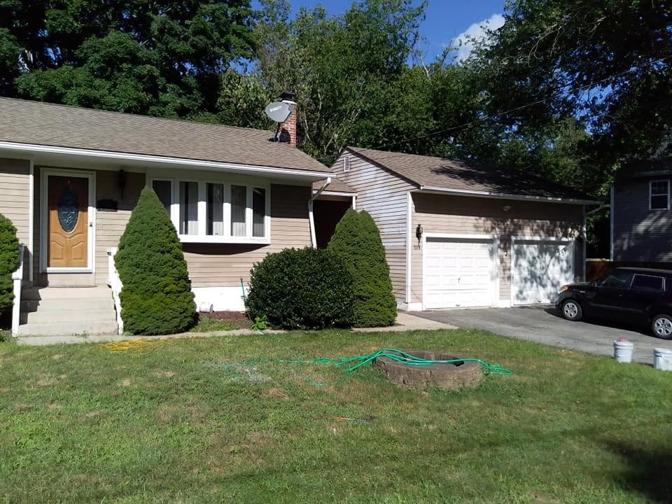 Ranch home and garage exterior painted by Genesis Painting