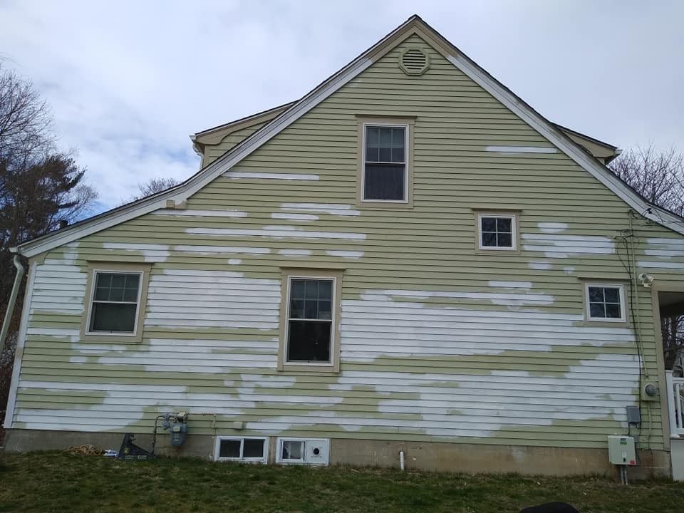 House exterior scraped and prepped for repaint by Genesis Painting