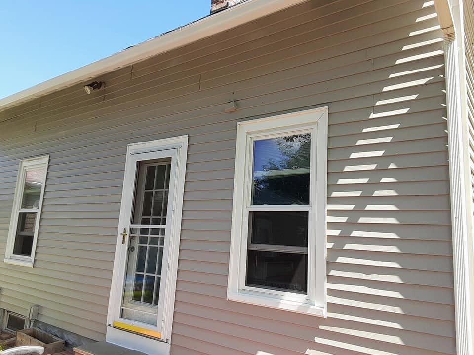 Clean, freshly prepped siding on a Rhode Island home by Genesis Painting