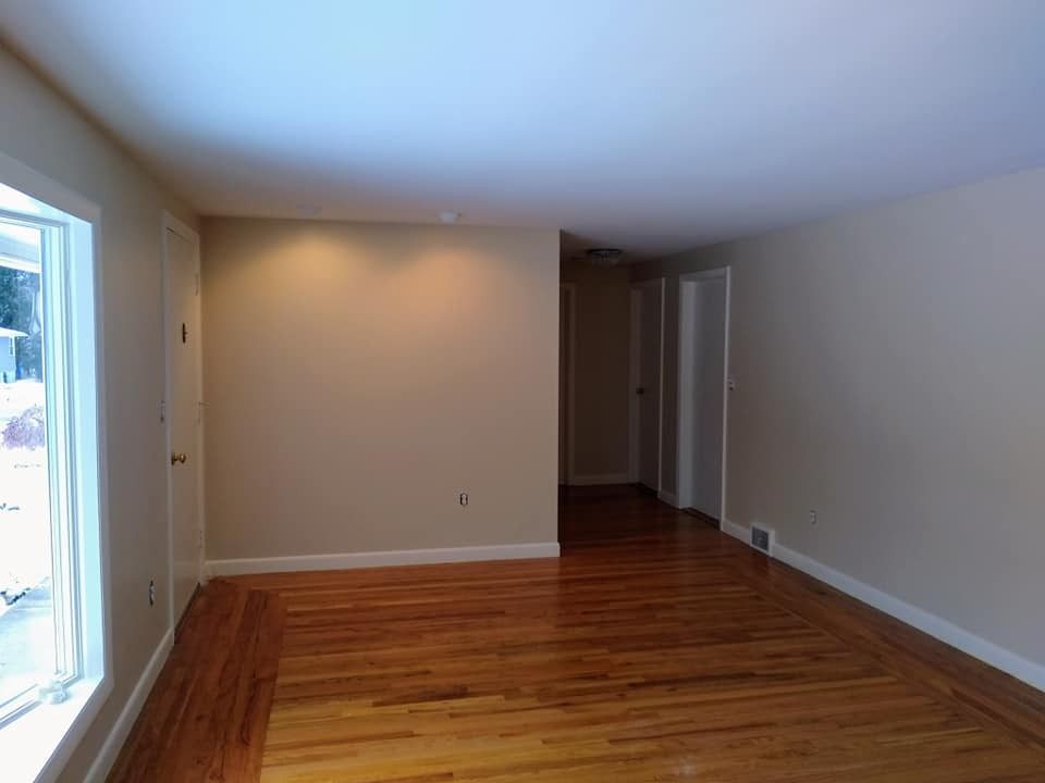 Empty room repainted and ready for move-out by Genesis Painting