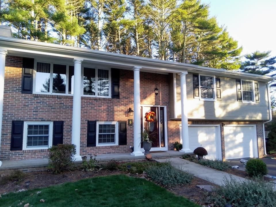 Colonial home exterior painted by Genesis Painting